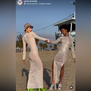 Santa brands iconic white shiny dress